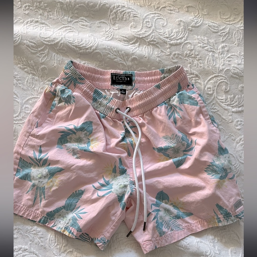Light pink with floral design swim trunks